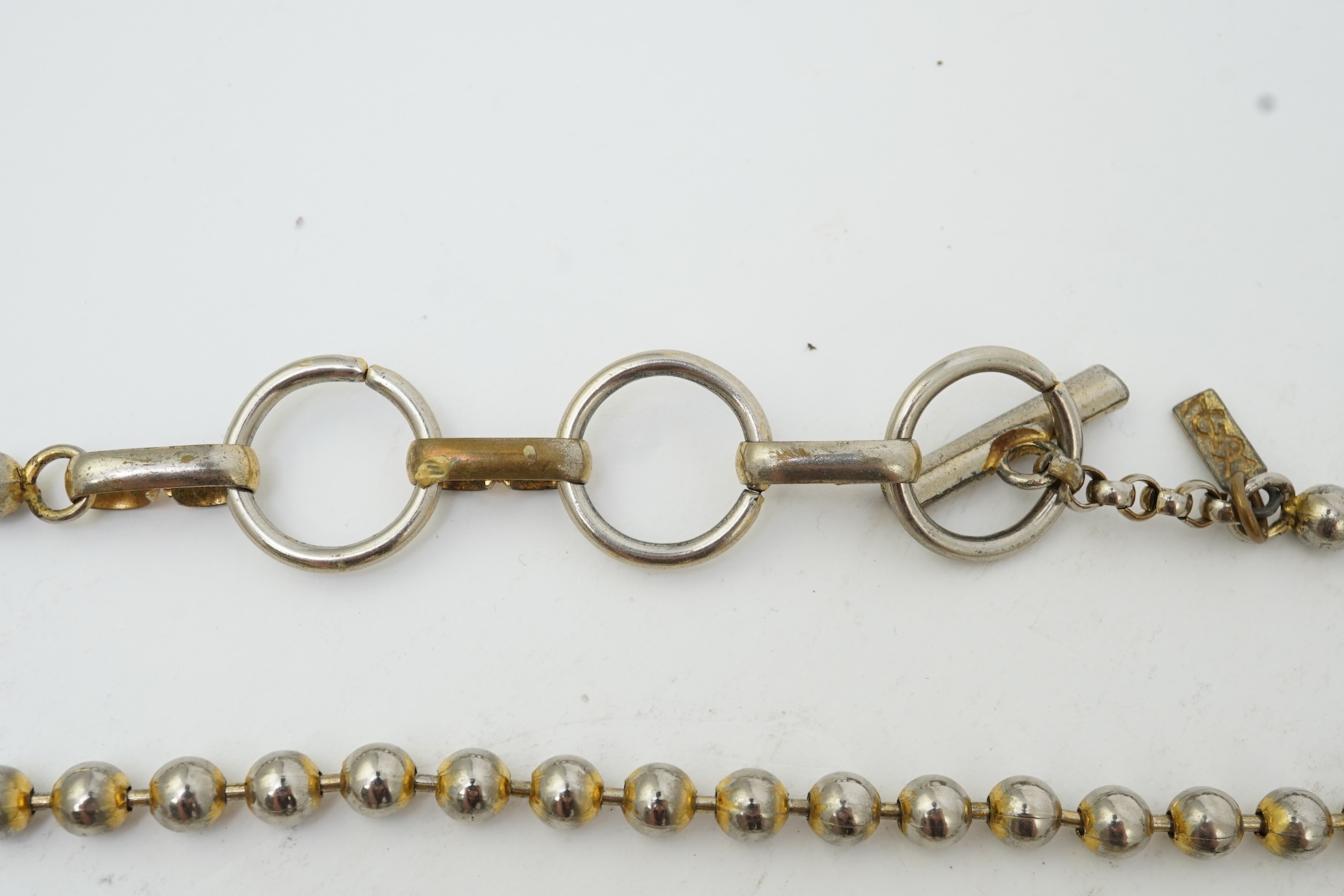 A collection of jewels and accessories including a Russian icon, comprising: a white glass bead rosary; a gilt metal and paste sacred heart motif for wall mounting, length 15.5cm; a gilt metal cube-shaped Nepro alarm clo